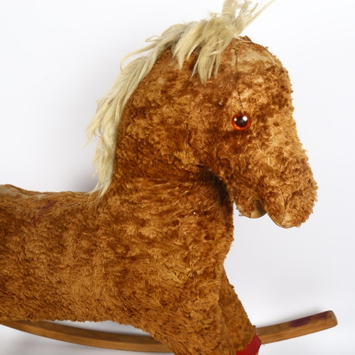 96 - A straw-filled Plush child's rocking horse, height 66cm