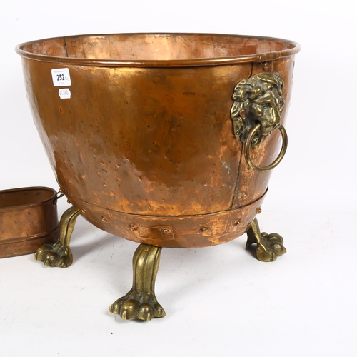 252 - A Victorian copper and brass coal bucket or log bin, with brass lion-head ring handles, and brass cl... 