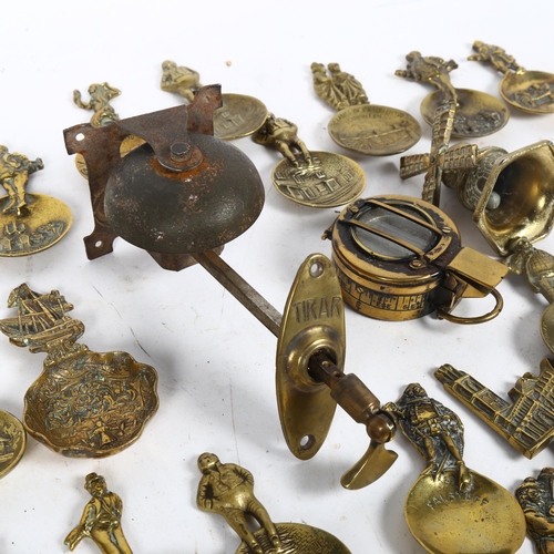 255 - A quantity of brass tea caddies or collector's spoons, including an Antique doorbell