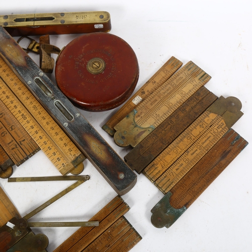 258 - A quantity of Vintage measuring instruments, tape measures, rulers and levels