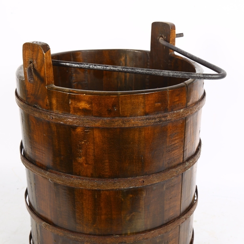 266 - A Chinese elm bucket, steel-bound, height 31cm