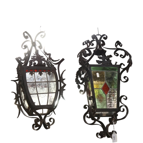 271 - A pair of scrolled wrought-iron lanterns, with leadlight glazed panels, the pair do not match, large... 