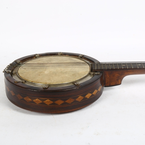 275 - An American rosewood banjolene with marquetry inlaid Native American design, late 19th or early 20th... 