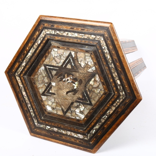 322 - A small Anglo-Moorish hexagonal occasional table, with inlaid mother-of-pearl marquetry, 34cm across... 