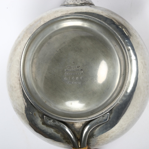 325 - LIBERTY & CO - Tudric pewter teapot, milk jug and sugar pot, serial markings to the underside of the... 