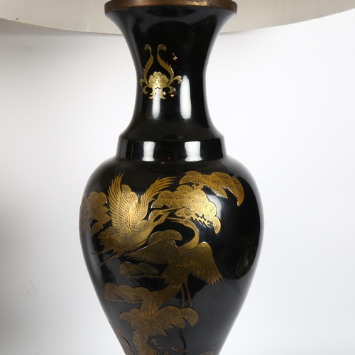 385 - A pair of large Japanese black lacquered table lamps and shades, with Oriental brass overlay decorat... 