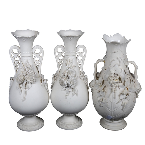 452 - A pair of Parian Ware vases, 32cm, and another with applied grapevine decoration