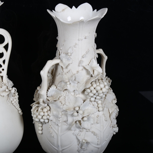 452 - A pair of Parian Ware vases, 32cm, and another with applied grapevine decoration