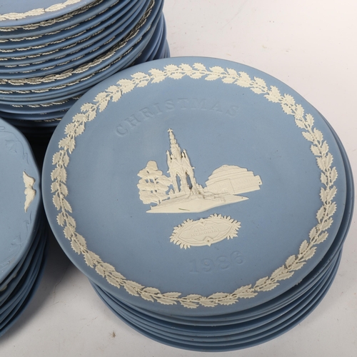 491 - A large quantity of Wedgwood blue Jasperware Christmas plates