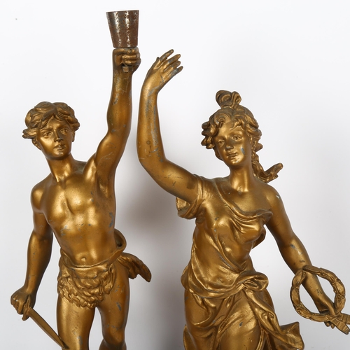 509 - A pair of French gilded spelter figures, Victoire & Glorie after Bruehon, tallest 52cm