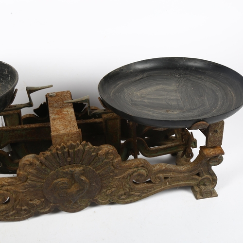 522 - An Antique set of cast-iron balance scales, with relief cockerel motif, width 62cm