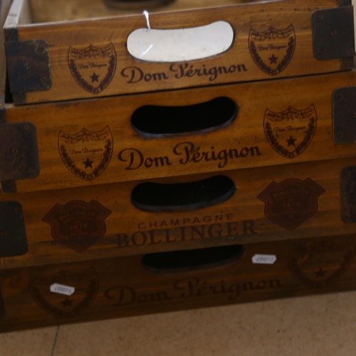 537 - A butler's tray stand, with a graduated set of 4 trays marked Dom Perignon, largest length 65.5cm