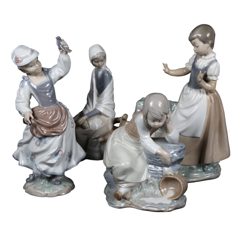 539 - 2 Lladro figures, girl with bird, and a seated girl, and 2 NAO figures, girl with pitcher, 28.5cm, a... 