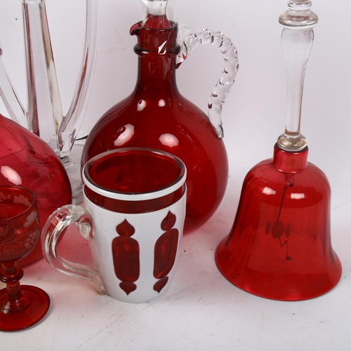 559 - 2 cranberry glass jug decanters, tallest 24cm, a uranium glass candle stand and cover, hexagonal can... 