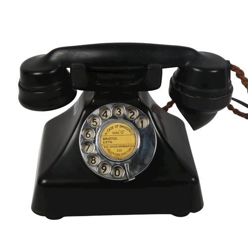 561 - A Vintage black Bakelite dial telephone