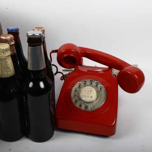 571 - 1960s red dial telephone, stoneware storage jars, and souvenir ales