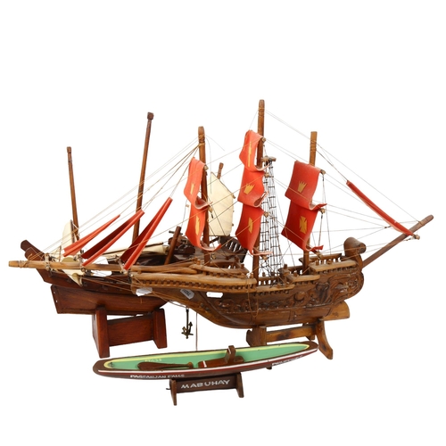 572 - A carved and painted 3-masted sailing ship, height on stand 42cm, and 2 other carved boats