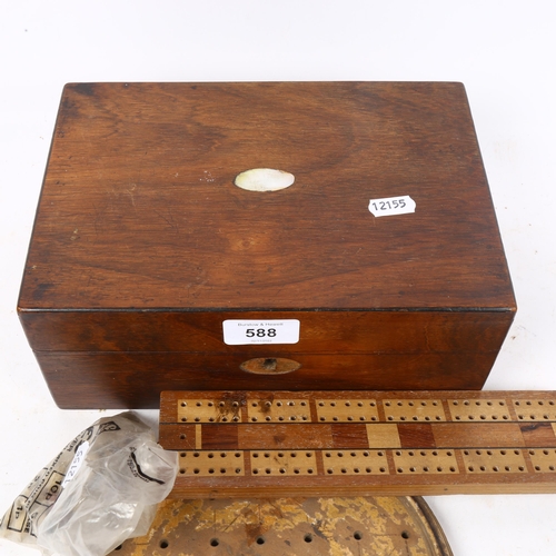 588 - A box with playing cards, cribbage board, solitaire game etc