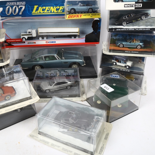 613 - A quantity of Corgi and various other diecast related vehicles, including various James Bond themed ... 