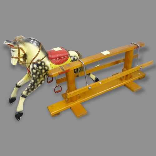 2687 - A Vintage painted wooden rocking horse, L130cm (A/F)