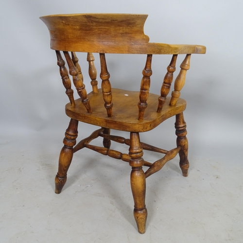 2699 - An elm-seated smoker's bow-arm chair