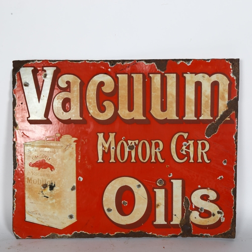 6 - A Vacuum Motorcar Oils double-sided flanged enamel sign, with oil can decoration, 52 x 40cm