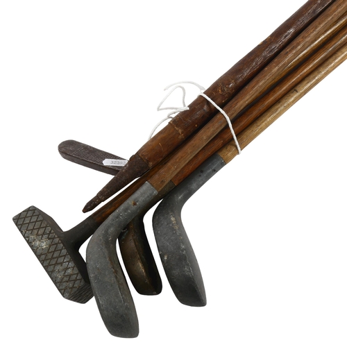 644 - A quantity of Vintage golf clubs and walking sticks, including thumb stick with various commemorativ... 