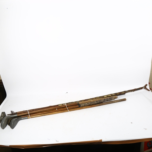 644 - A quantity of Vintage golf clubs and walking sticks, including thumb stick with various commemorativ... 