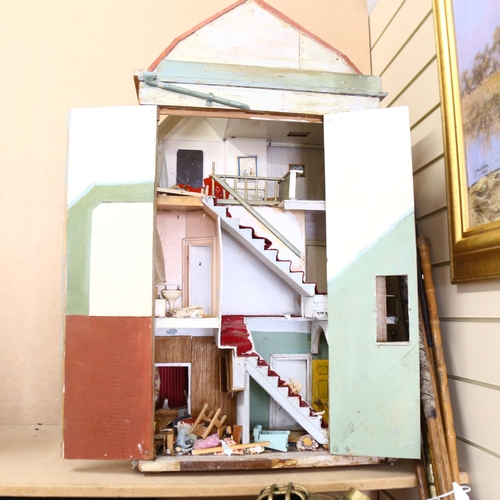 645 - A Vintage doll's house in the style of a townhouse, 3 floors with fitted interior, height 92cm, leng... 