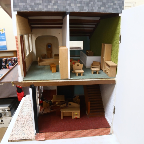 656 - A modern doll's house with 2 furnished floors, H 82cm, L63cm, W62cm