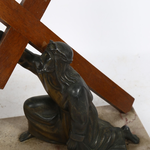 669 - An Art Deco table lamp, with a religious scene, marble base and spelter figure, length 32cm