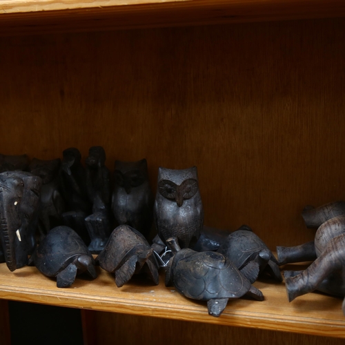 675 - A quantity of ebony wood Vintage animal figurines, including rhinos, turtles and owls, and a set of ... 