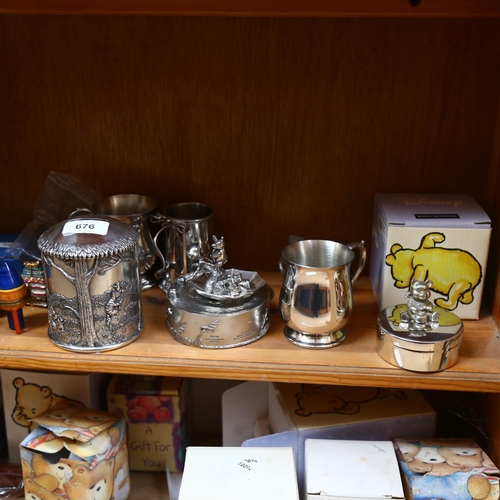 676 - A quantity of pewter christening gifts, including Disney Winnie The Pooh money box, a modern hip fla... 