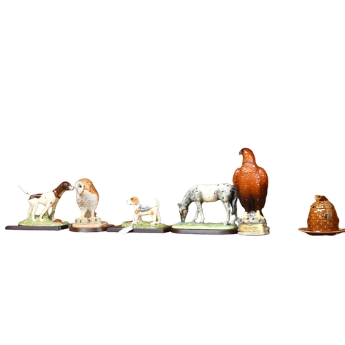 685 - A group of 4 Royal Doulton animal figures, on separate plinths, including a Barn owl, 2 Pointers, an... 