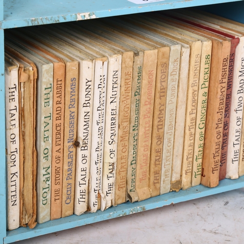 687 - 21 Beatrix Potter children's books, in original book shelf