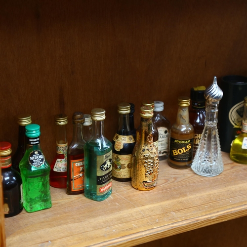 688 - A large quantity of alcoholic miniatures, including Martini, Brandy, Baileys, Malibu etc, including ... 