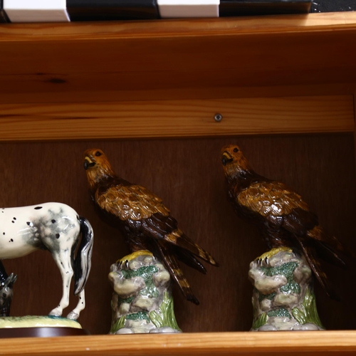 698 - A group of 7 Royal Doulton animal figures, on separate plinths, including a Barn owl, a Golden eagle... 