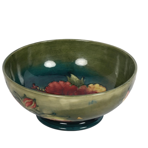 719 - A Moorcroft bowl with tube-lined floral decoration (A/F), diameter 19cm