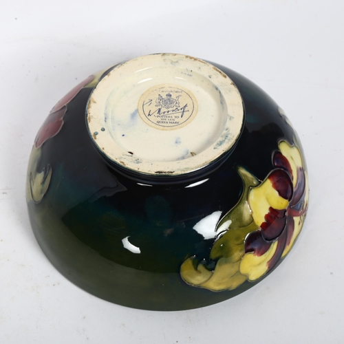 730 - A Moorcroft bowl on foot, with original paper label, and tube-lined floral design, diameter 16cm