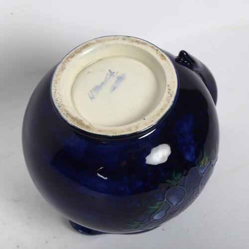 731 - A Moorcroft blue ground jug with anemone decoration, signed W Moorcroft (A/F), height 11.5cm