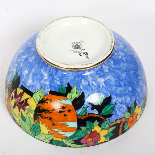 737 - A Malingware lustre bowl on foot, with design of flowers and butterflies, diameter 22cm