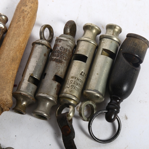 754 - A collection of Vintage whistles, including LSWR Bakelite whistle, boy scout whistle etc