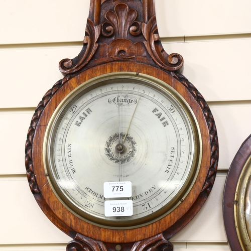 775 - BALOM & COMPANY LONDON AND EDINBURGH - a Victorian carved oak-framed aneroid barometer, length 95cm