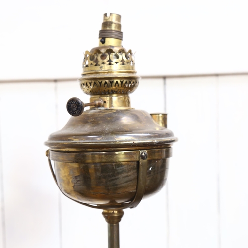 800 - Antique brass telescopic oil lamp on tripod stand, height 170cm extened