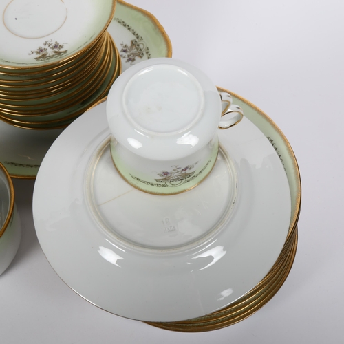 802 - A Continental porcelain tea service, with gilded decoration