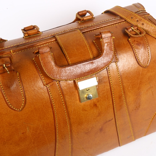 807 - A modern hide travel bag with brass mounts, length 43cm