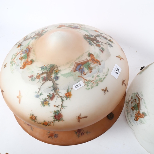 855 - A pair of 1930s ceiling light shades with Oriental decoration, largest diameter 40cm, drop 25cm (2)