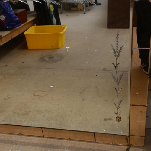 874 - A large 1950s peach and clear glass bevel-edge wall mirror, with floral decoration, 112cm x 87cm