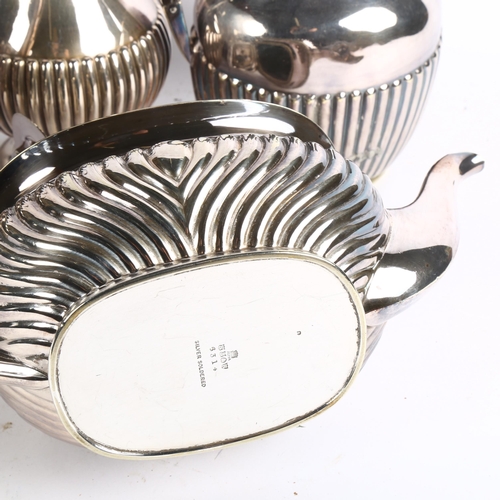 1002 - A group of silver plated half fluted tea and coffee pots, spirit kettle on stand etc