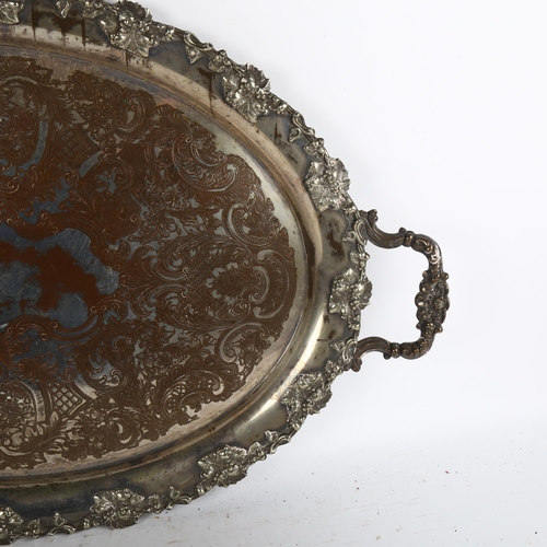 1005 - A large Victorian silver plate on copper 2-handled serving tray, with engraved and cast grape leaf d... 